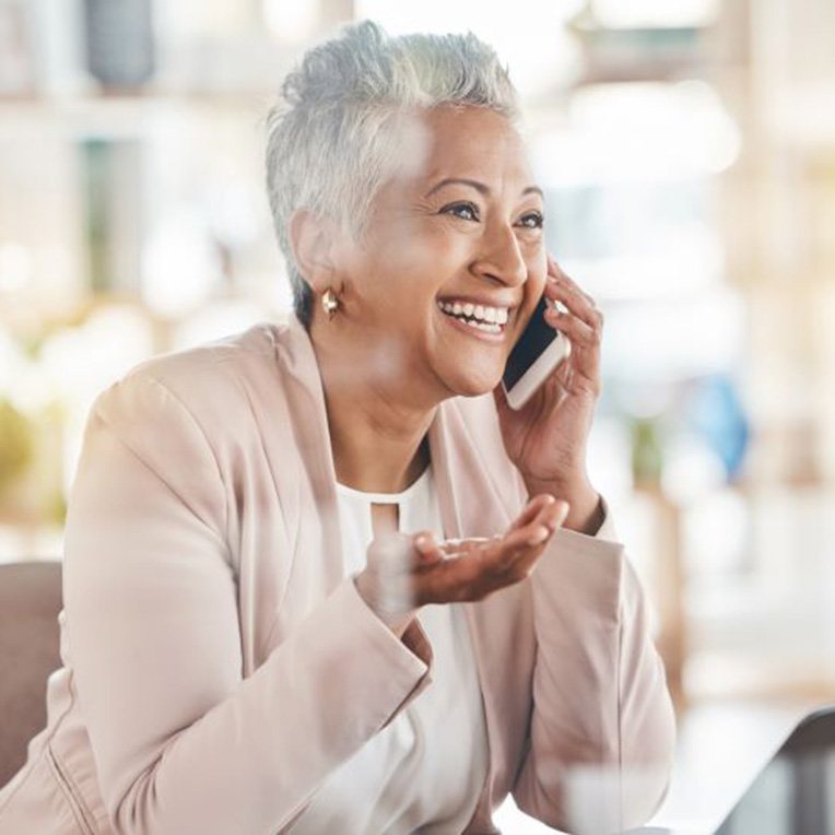 Happy senior woman talking on phone
