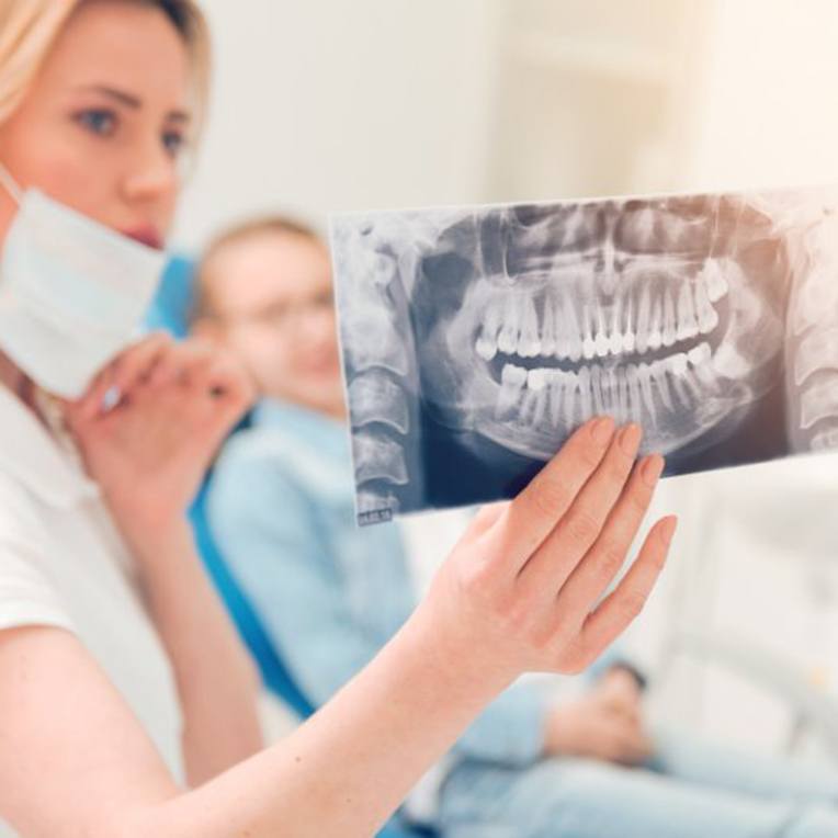 Dentist showing a patient his X-ray results