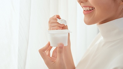 woman eating yogurt