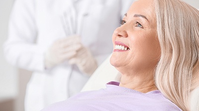 woman smiling after getting dental implants