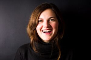 Smiling woman with a gap between her front teeth 